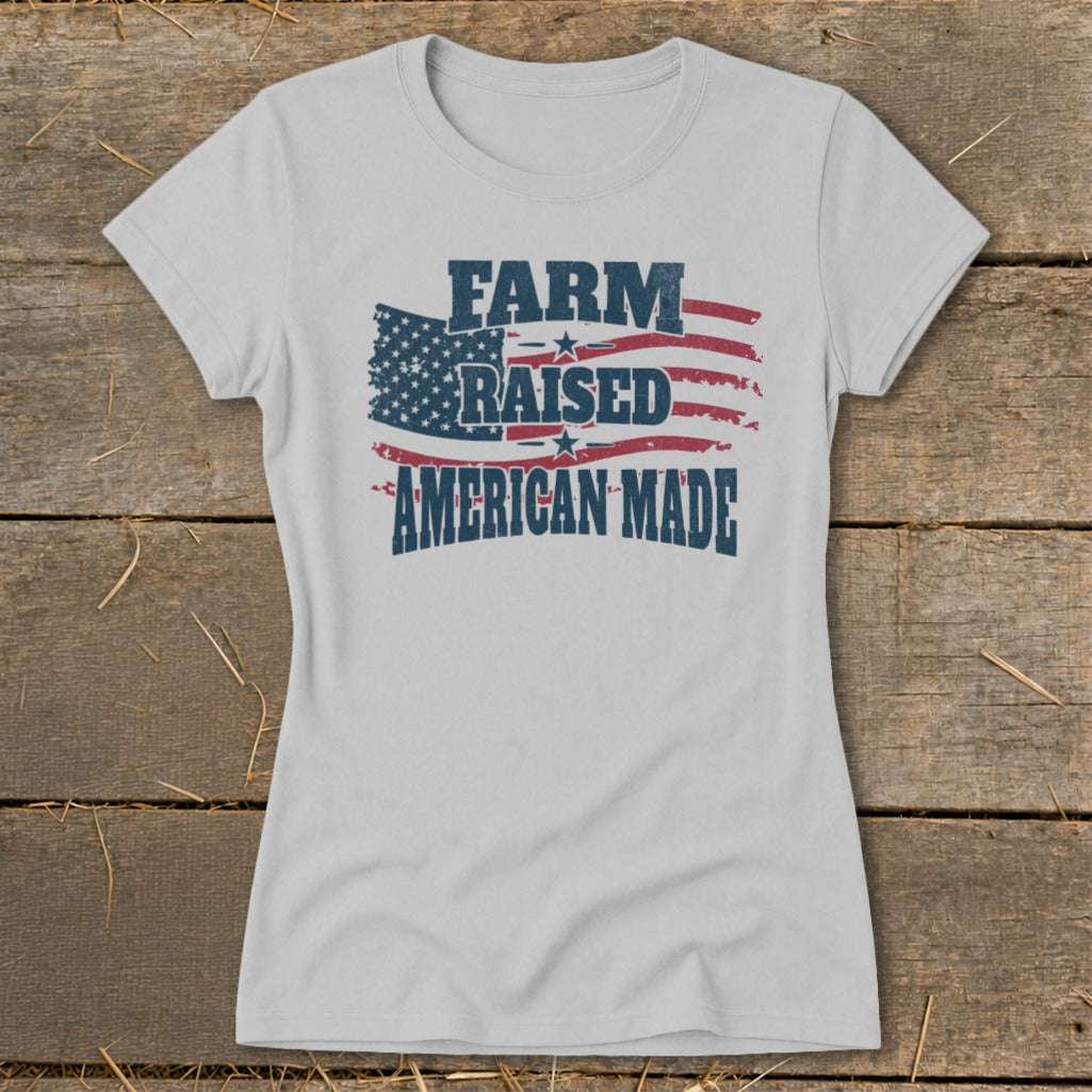 Light grey t-shirt with "FARM RAISED AMERICAN MADE" in distressed text on an American flag graphic.