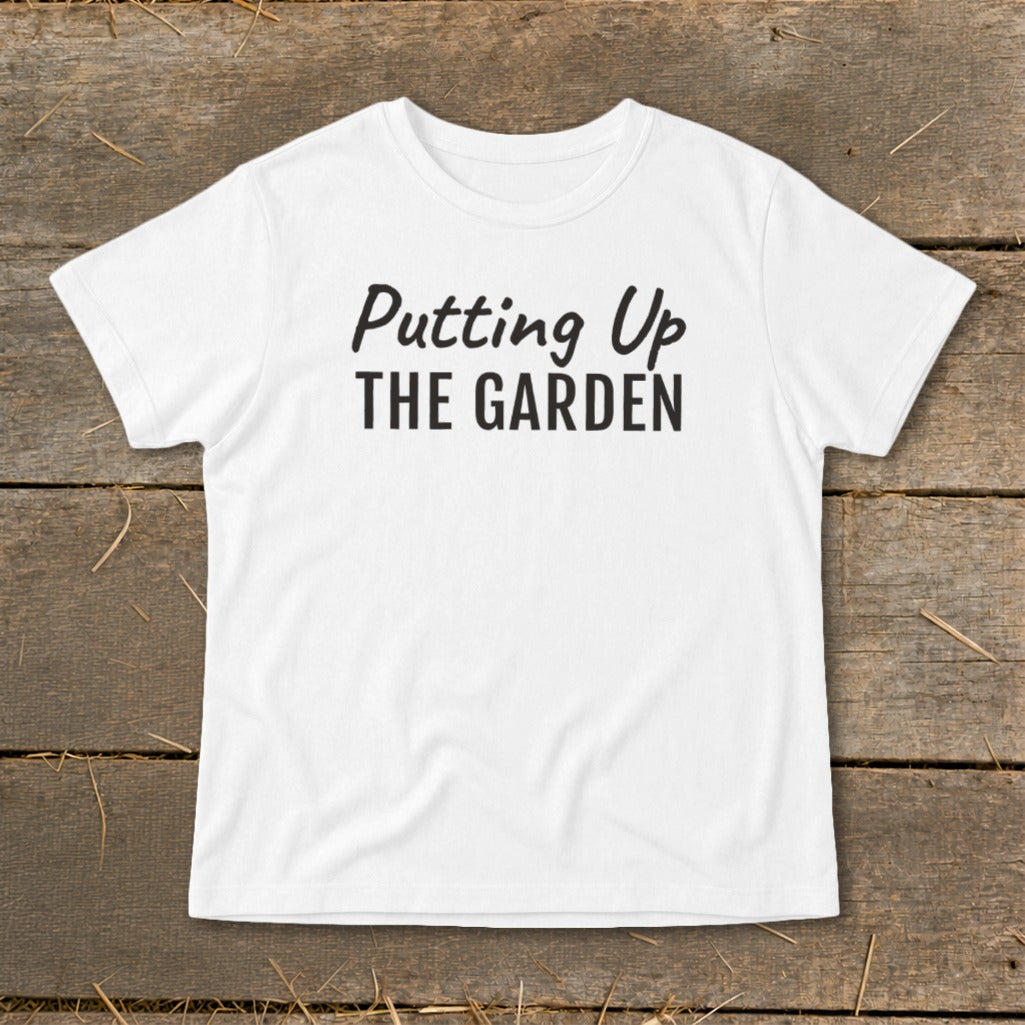 White t-shirt with black text reading "Putting Up THE GARDEN"