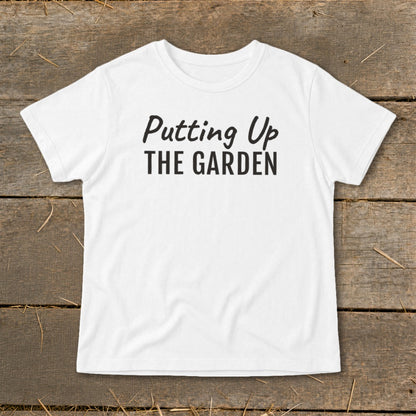 White t-shirt with black text reading "Putting Up THE GARDEN"