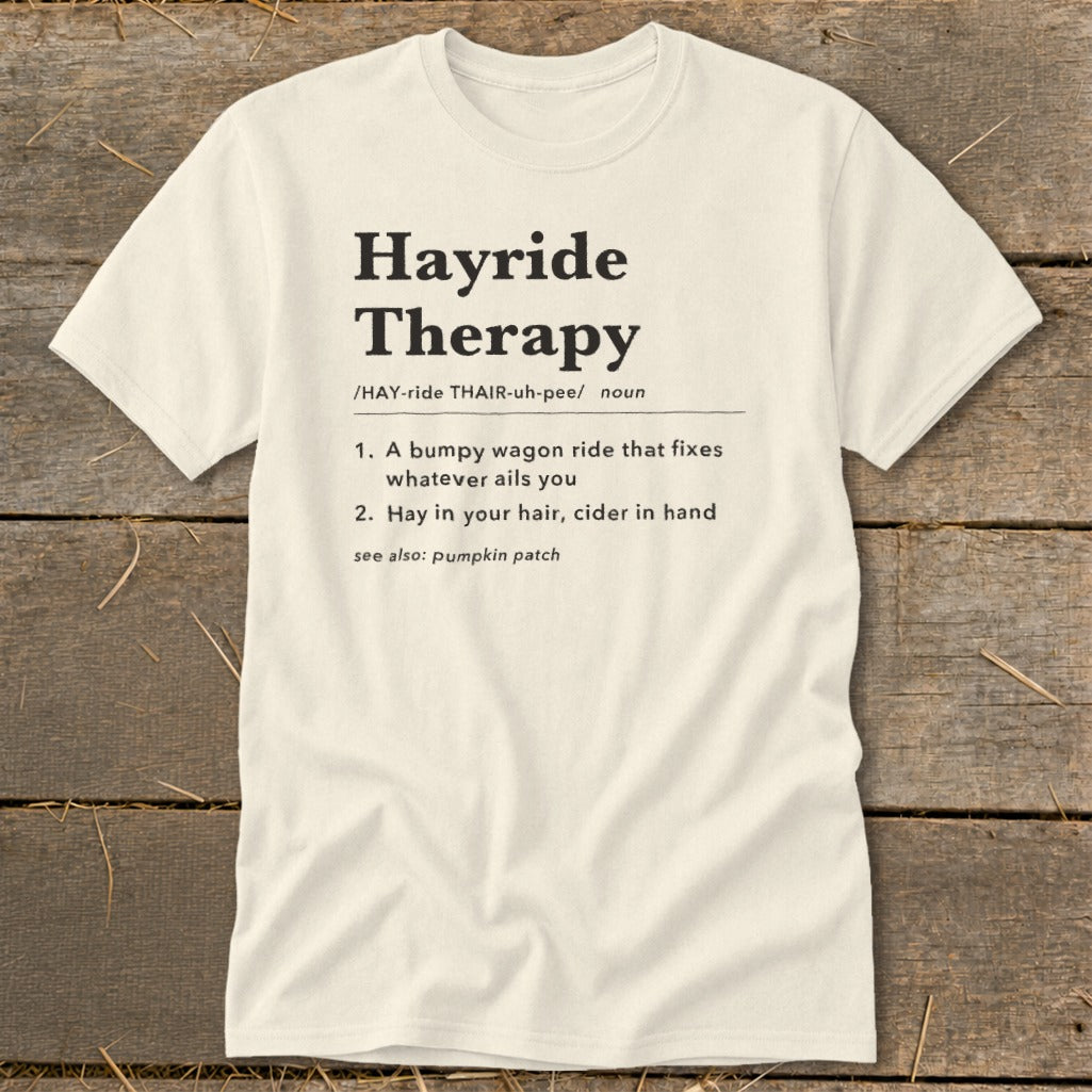 Cream t-shirt with "Hayride Therapy" definition: bumpy wagon ride, hay in hair, cider.