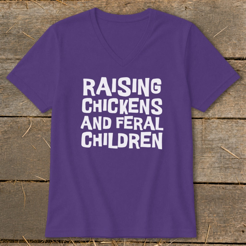 Purple v-neck t-shirt with white text reading "Raising Chickens and Feral Children."