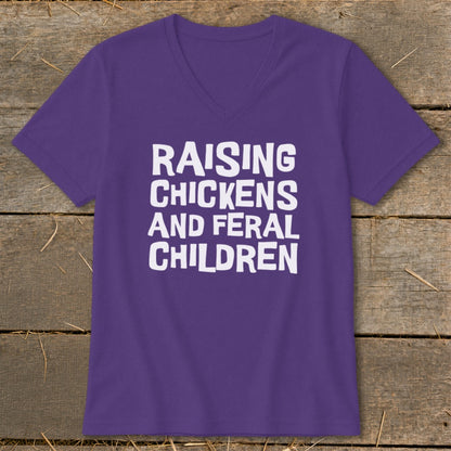 Purple v-neck t-shirt with white text reading "Raising Chickens and Feral Children."