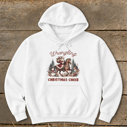 White hoodie with "Wrangling Christmas Cheer" text and Santa on horseback graphic.