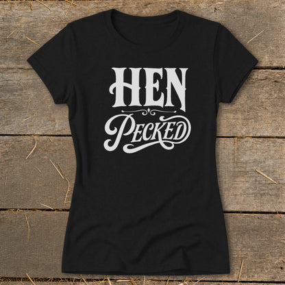 Black t-shirt with white text that reads "HEN PeckED" in decorative fonts.