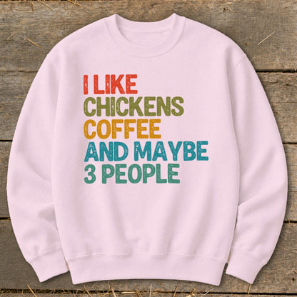 Pink sweatshirt with text "I LIKE CHICKENS COFFEE AND MAYBE 3 PEOPLE."