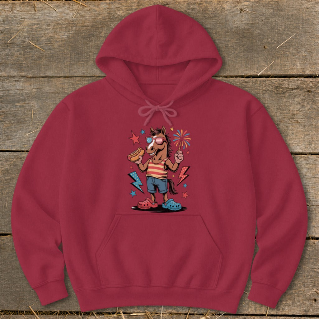 Horse wearing sunglasses, holding hot dog and fireworks, on maroon hoodie.