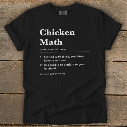 Black t-shirt with white text defining "Chicken Math" and its humorous explanations.