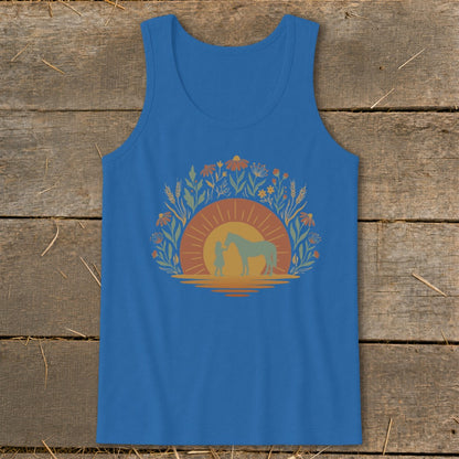 Blue tank top with graphic of girl and horse at sunset surrounded by flowers.