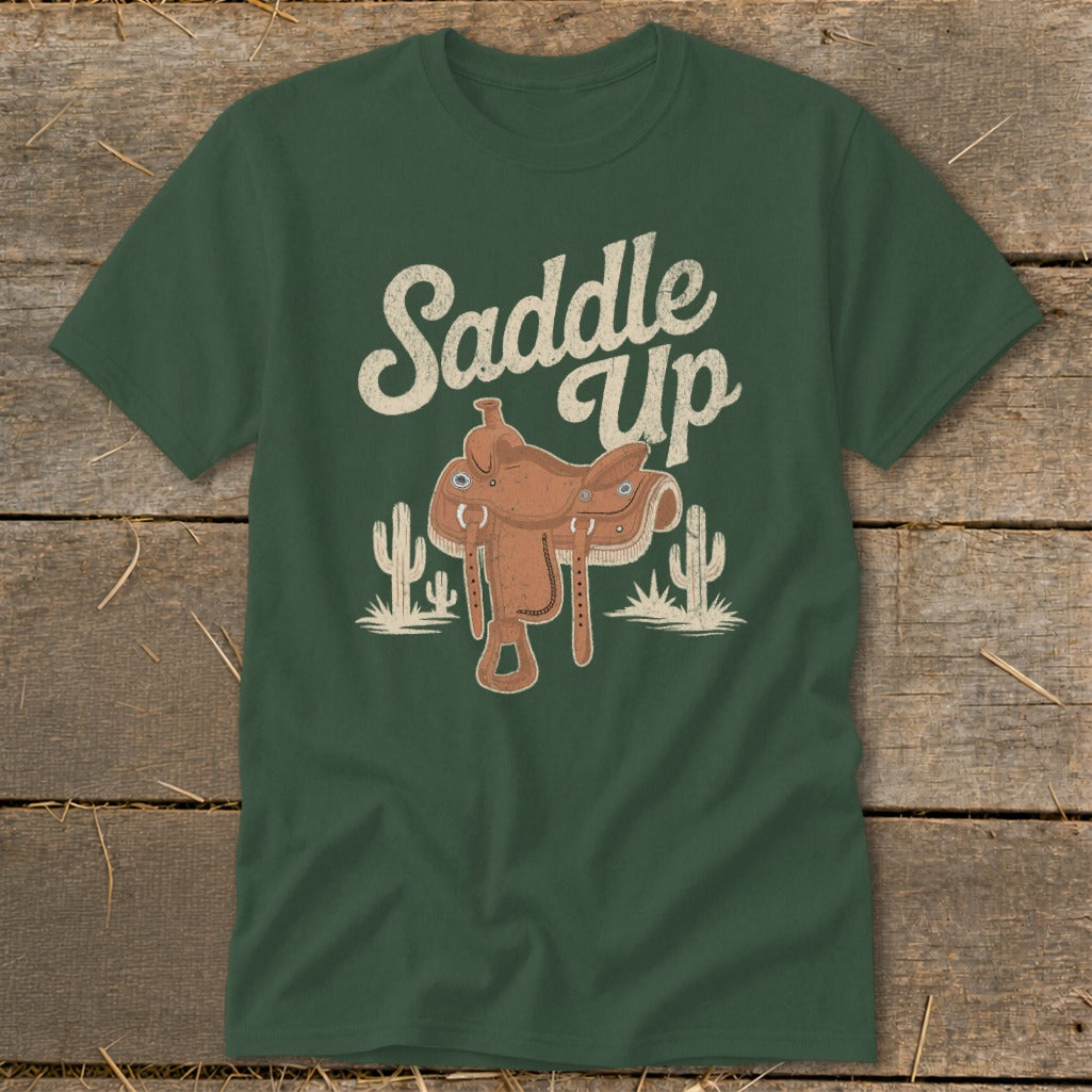 Green t-shirt with "Saddle Up" text, a saddle, and cacti graphics.