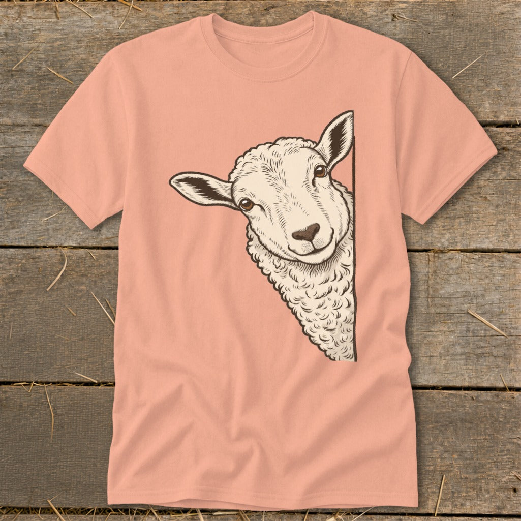 Peach t-shirt with a line drawing of a sheep peeking from the side.
