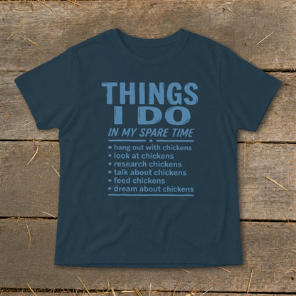 Dark blue t-shirt with "Things I Do In My Spare Time" and chicken-related activities listed.