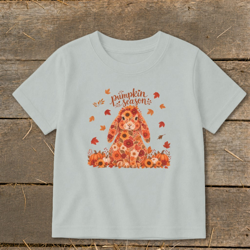 Light blue t-shirt with a floral bunny and "pumpkin season" text.