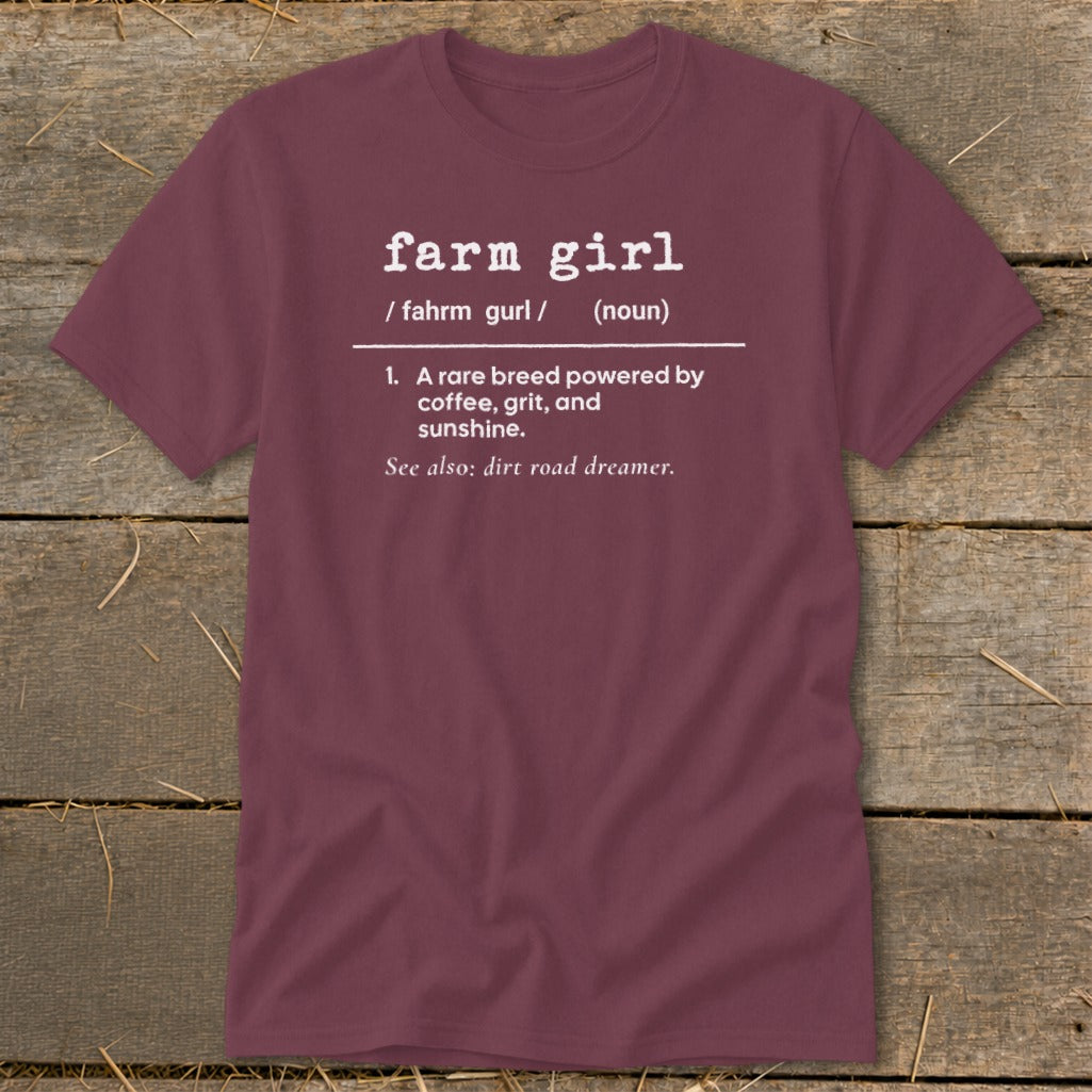 Maroon t-shirt with "farm girl" definition including "A rare breed powered by coffee, grit, and sunshine."