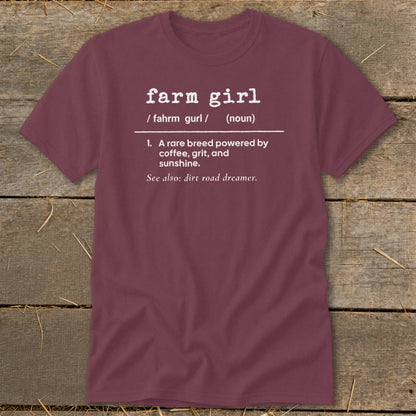 Maroon t-shirt with "farm girl" definition including "A rare breed powered by coffee, grit, and sunshine."
