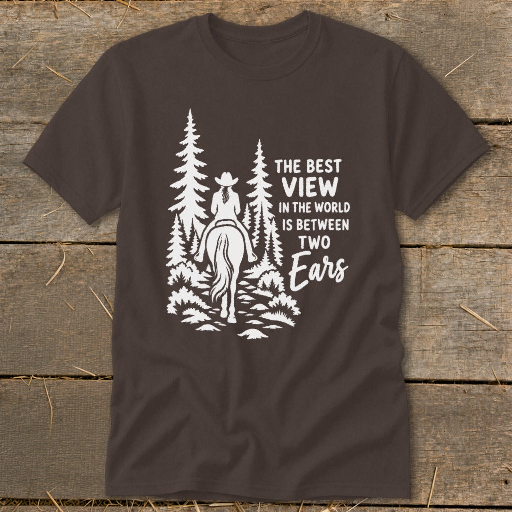 Brown t-shirt featuring a white graphic of a horseback rider in the forest with text.