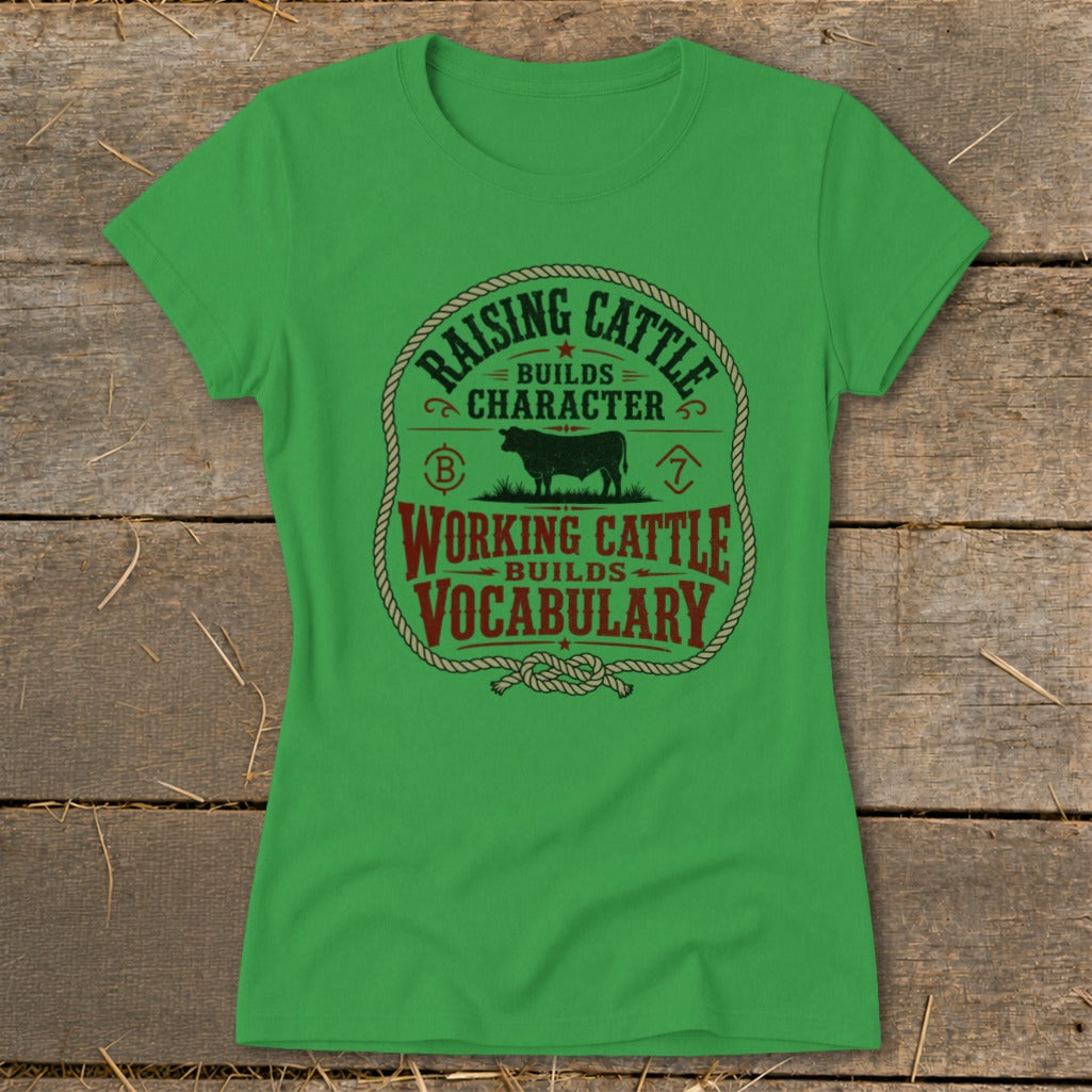 Green t-shirt with "Raising Cattle Builds Character, Working Cattle Builds Vocabulary" text and cow graphic.