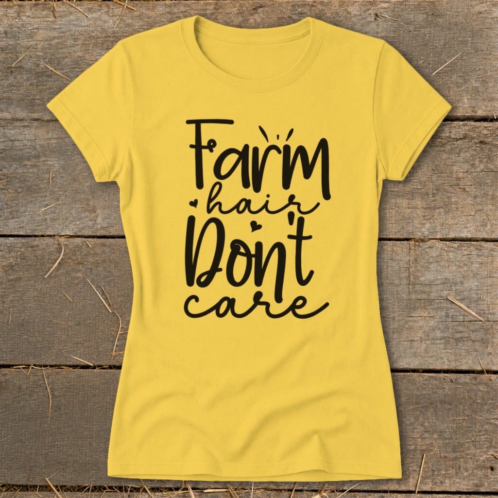 Yellow t-shirt with black text reading "Farm hair don't care".