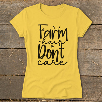 Yellow t-shirt with black text reading "Farm hair don't care".