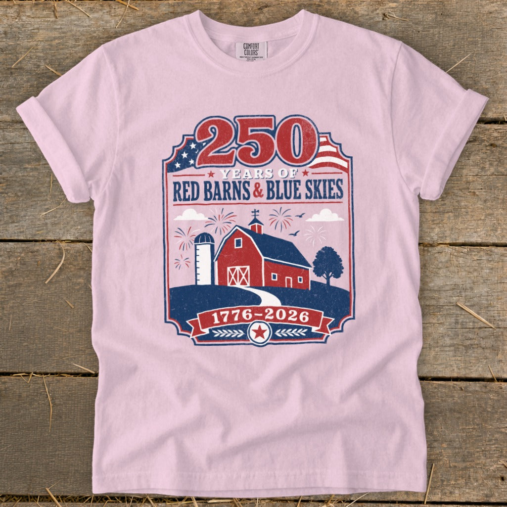 Pink t-shirt with 250 Years of Red Barns & Blue Skies 1776-2026 graphic.