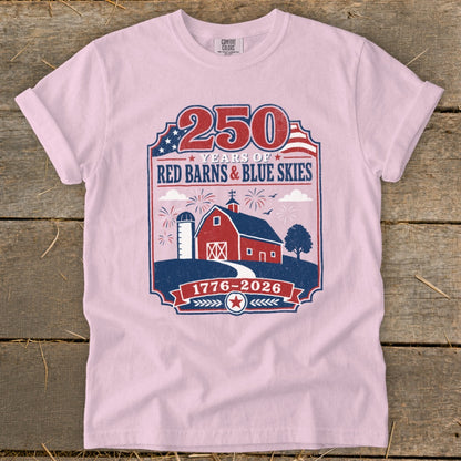 Pink t-shirt with 250 Years of Red Barns & Blue Skies 1776-2026 graphic.