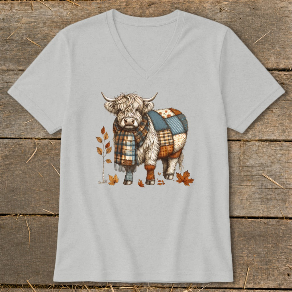 Highland cow with patchwork quilt body and plaid scarf on light gray t-shirt.