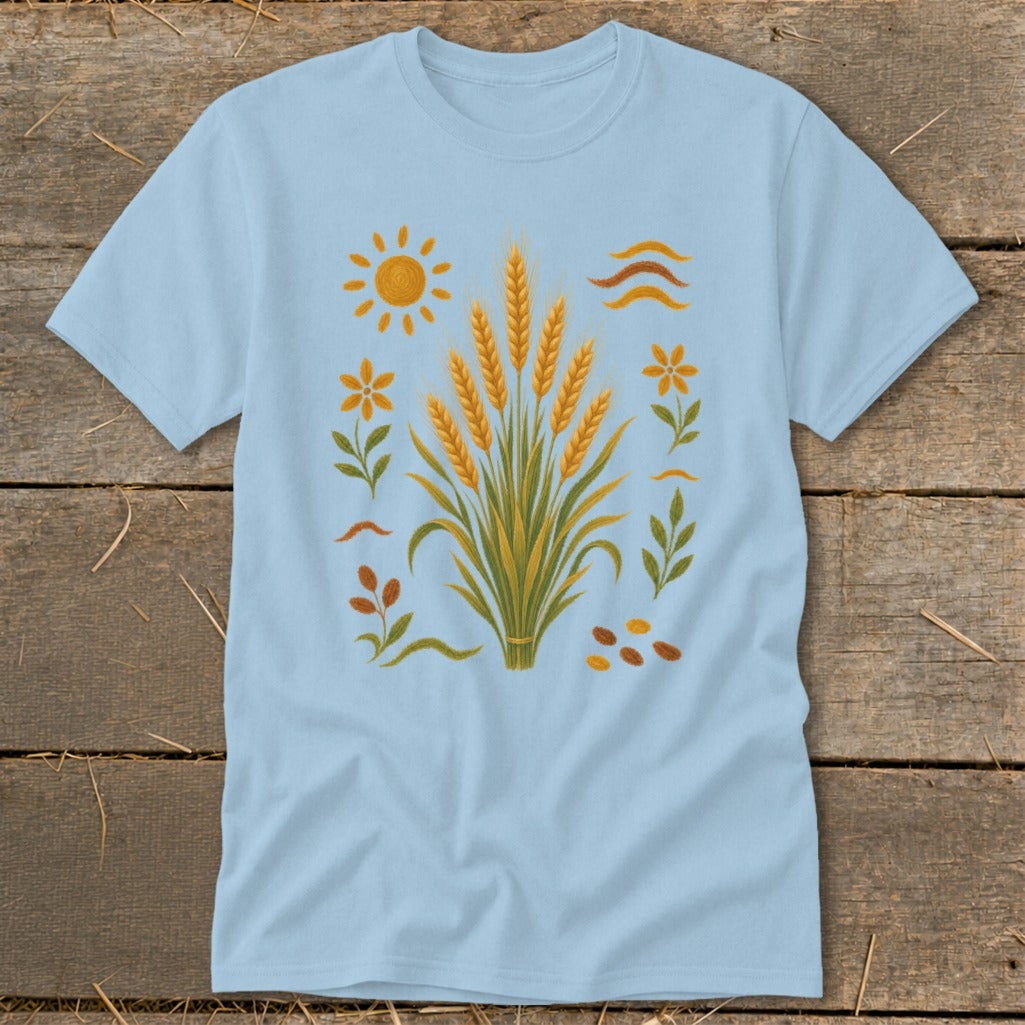 Light blue t-shirt with a central wheat stalk design and surrounding sun, flowers, and leaves.