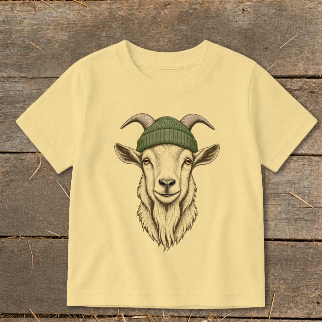 Cream t-shirt with a drawing of a goat wearing a green beanie.