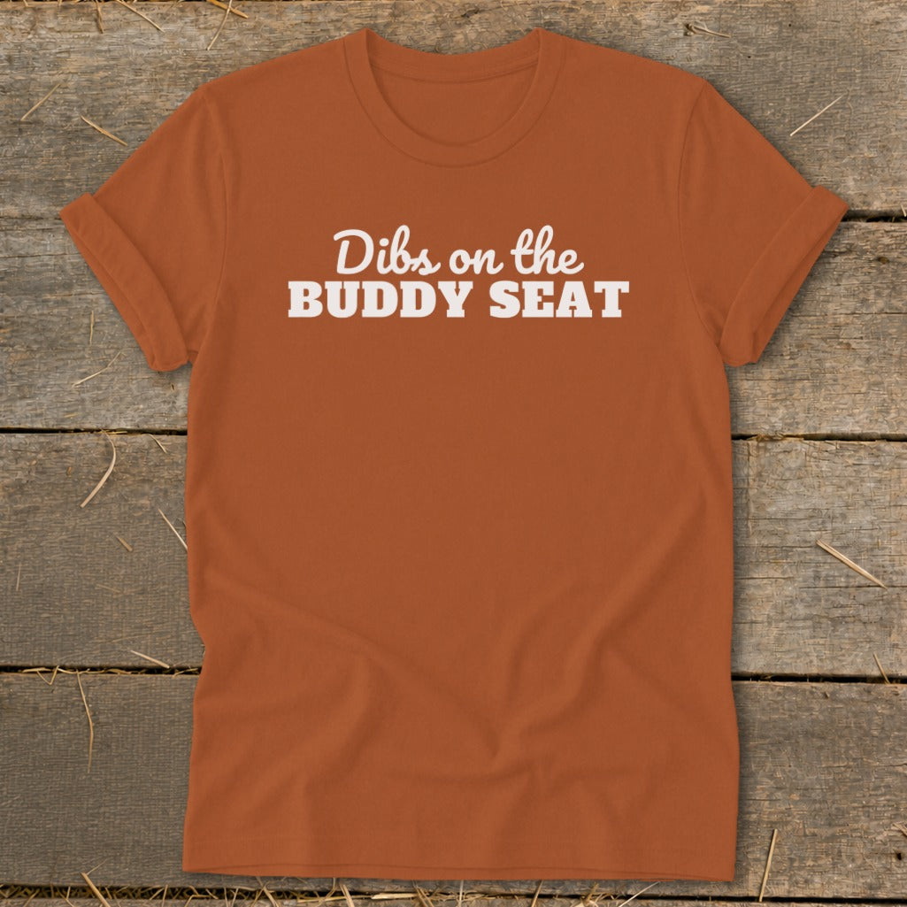 Orange t-shirt with white text that reads "Dibs on the BUDDY SEAT."