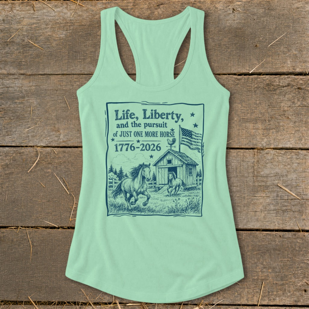 Light green tank top with dark blue graphic of horses, barn, flag, and text about horses.