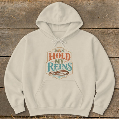 Cream hoodie with "Hold My Reins" text and horse reins graphic.