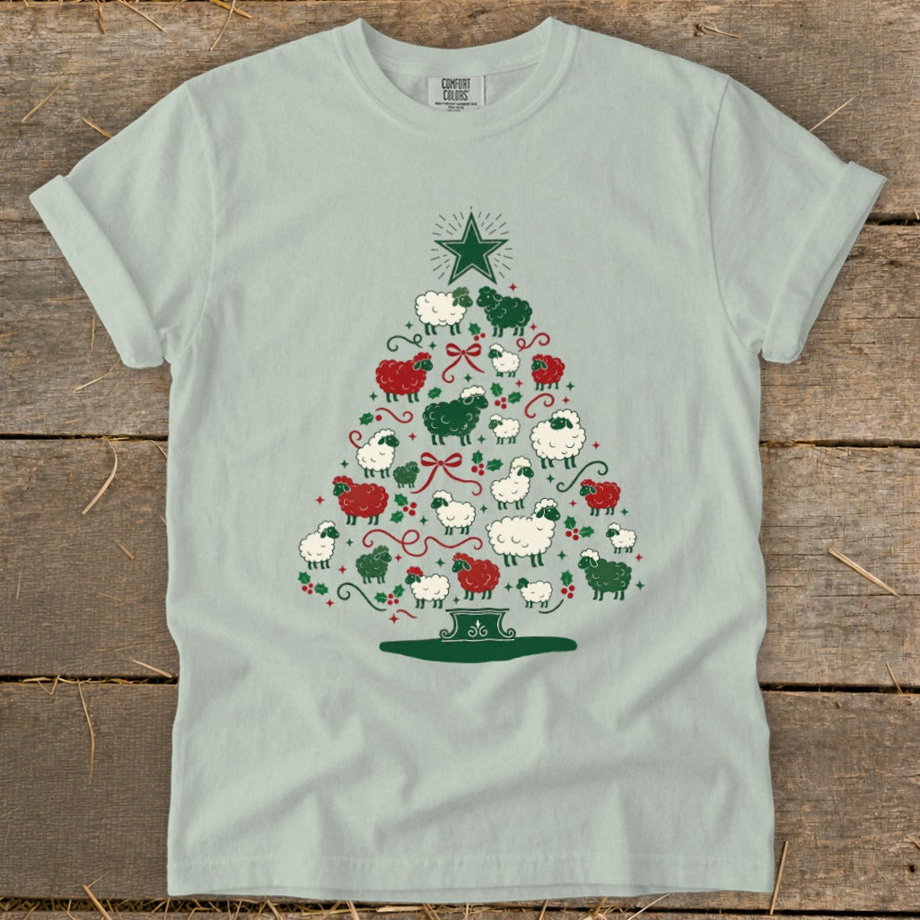 Light blue t-shirt with a Christmas tree design made of sheep.