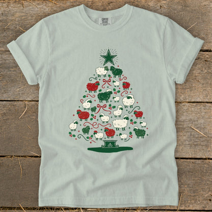 Light blue t-shirt with a Christmas tree design made of sheep.