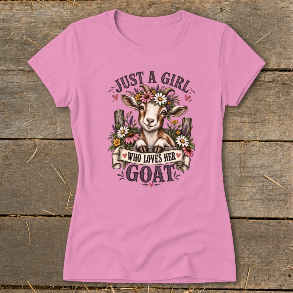 Pink t-shirt with a graphic of a goat wearing a flower crown and the text "Just a girl who loves her goat."