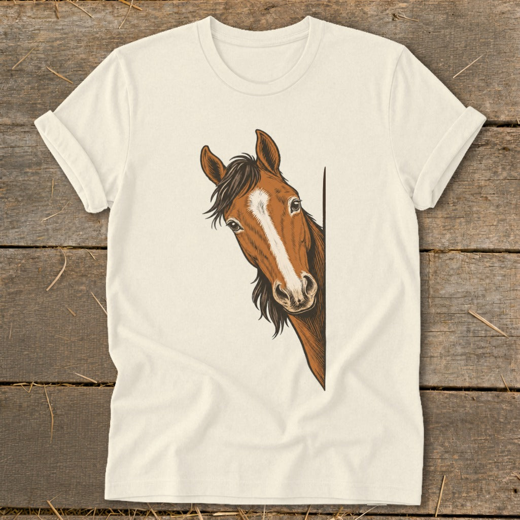 A brown horse with a white blaze peeks from behind a corner on a cream t-shirt.