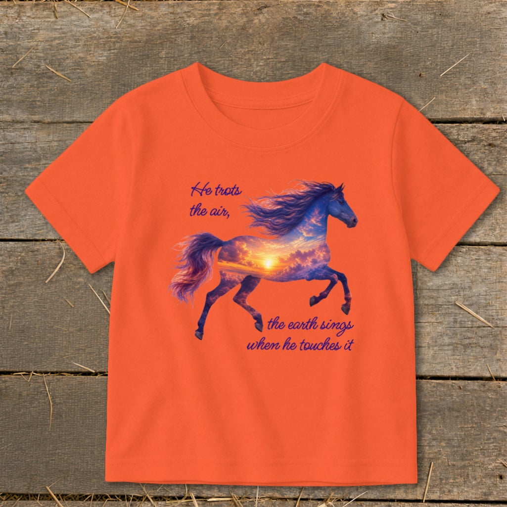 Bright orange short-sleeved children's t-shirt printed with a running horse silhouette containing a sunset sky and text.