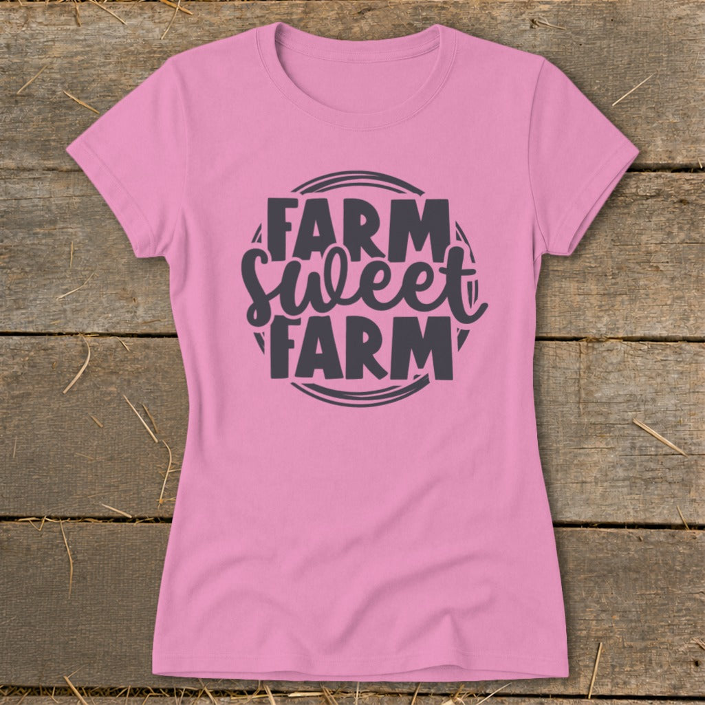 Pink t-shirt with "Farm Sweet Farm" text graphic in dark gray.