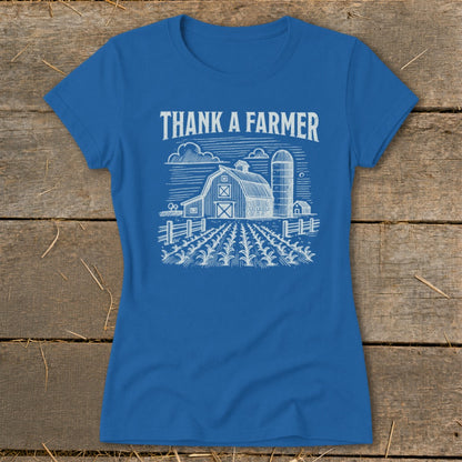Blue t-shirt with "Thank a Farmer" text and a barn with silo and cornfield graphic.