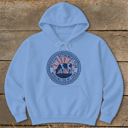 Light blue hoodie with a circular graphic featuring a cow and text: "OFFICIAL RETIREMENT PLAN WORKING FOR MY COWS".