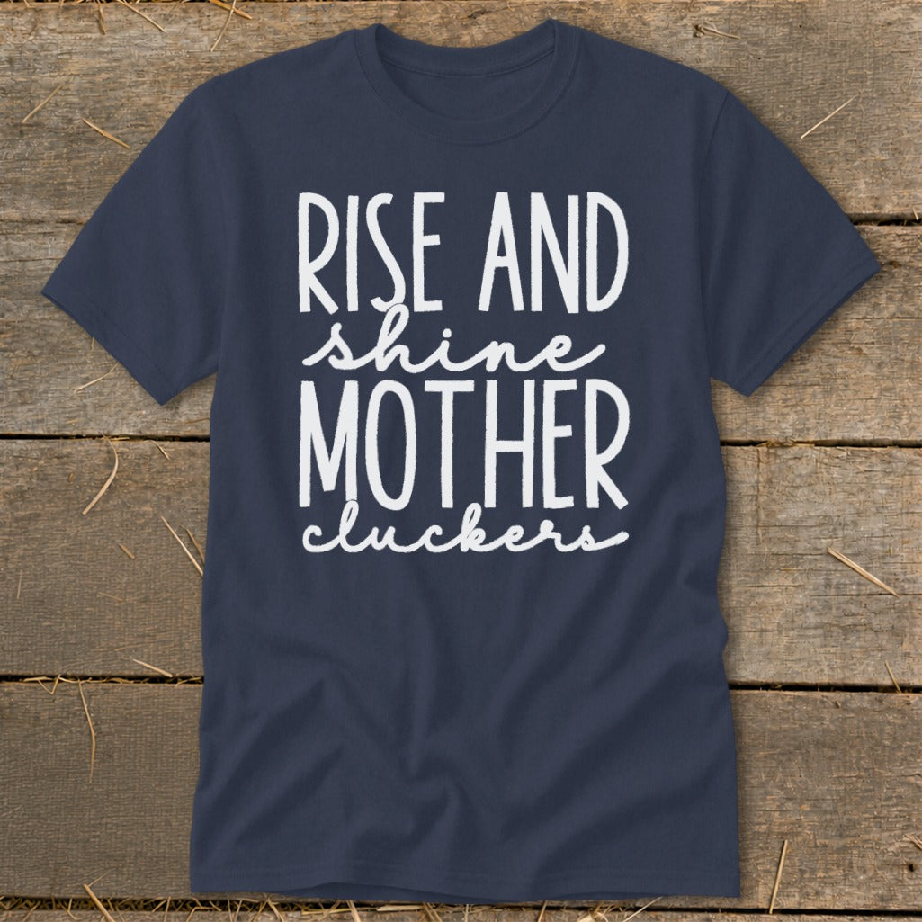 Navy t-shirt with white text reading "Rise and shine mother cluckers."