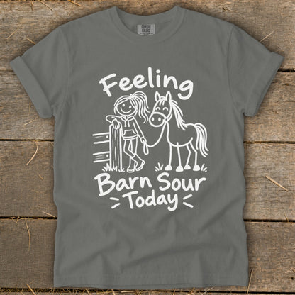 Gray t-shirt with white line art of a girl and horse and text "Feeling Barn Sour Today".