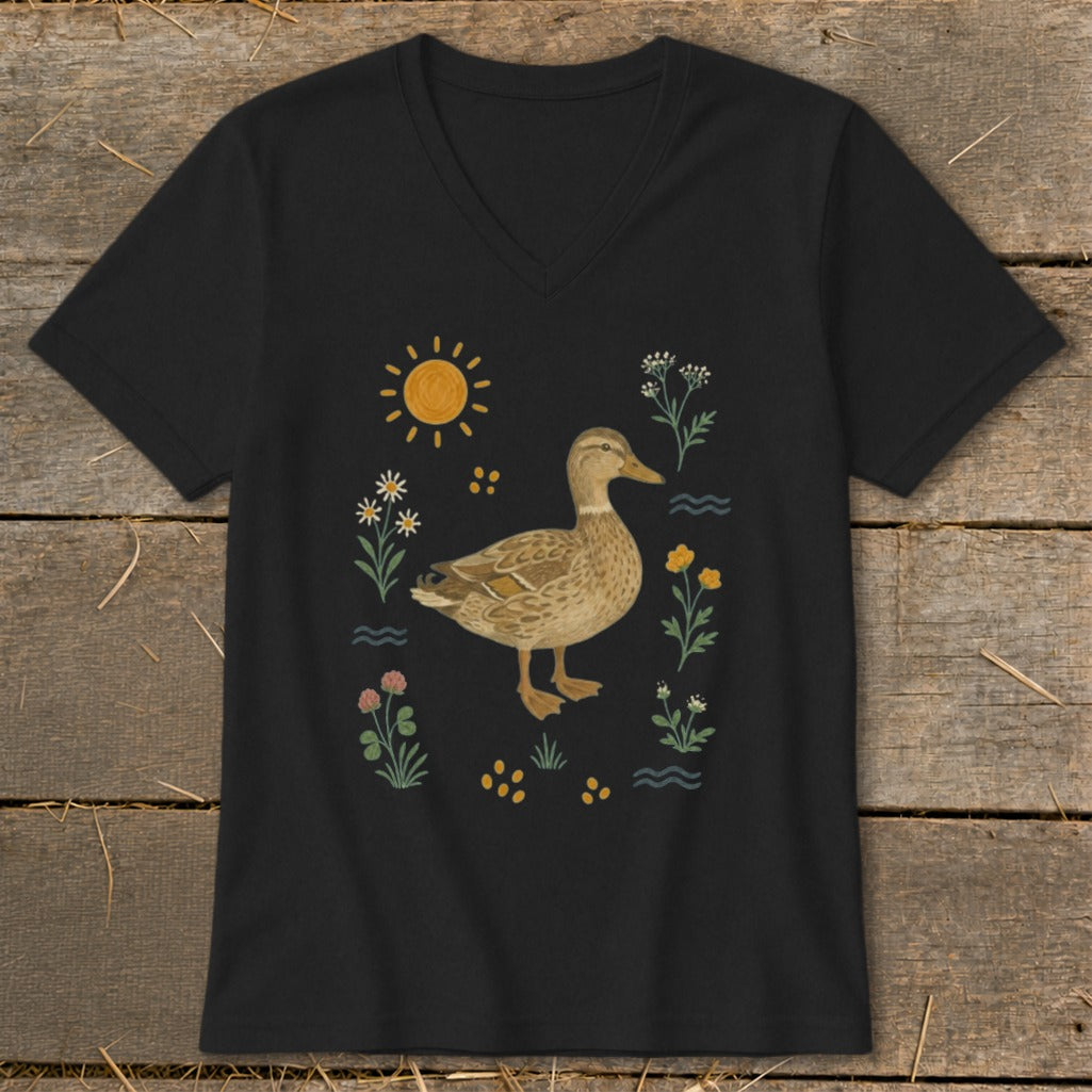 Black t-shirt with a stylized duck surrounded by flowers and sun.