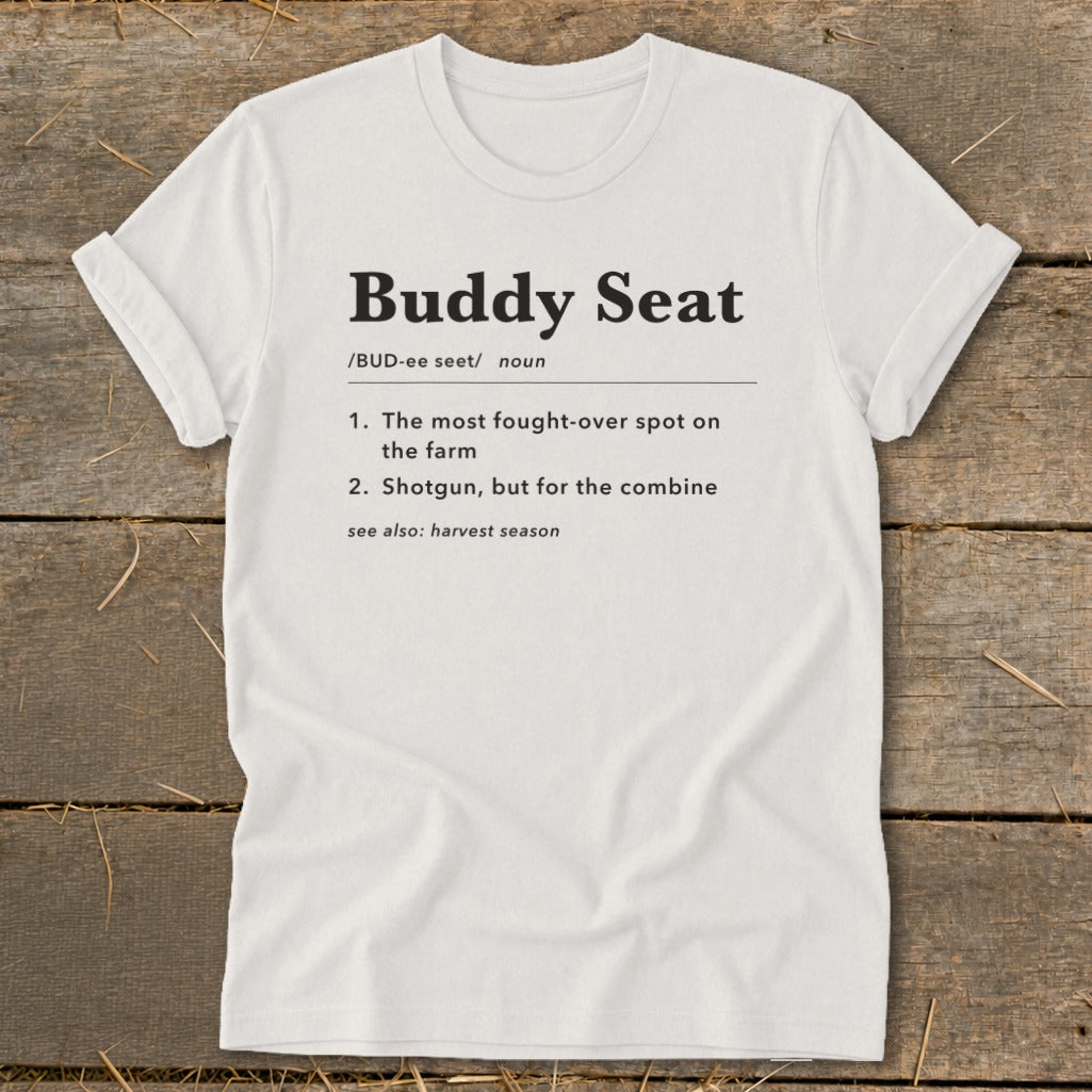White t-shirt with "Buddy Seat" definition: fought-over spot on the farm, shotgun for the combine.