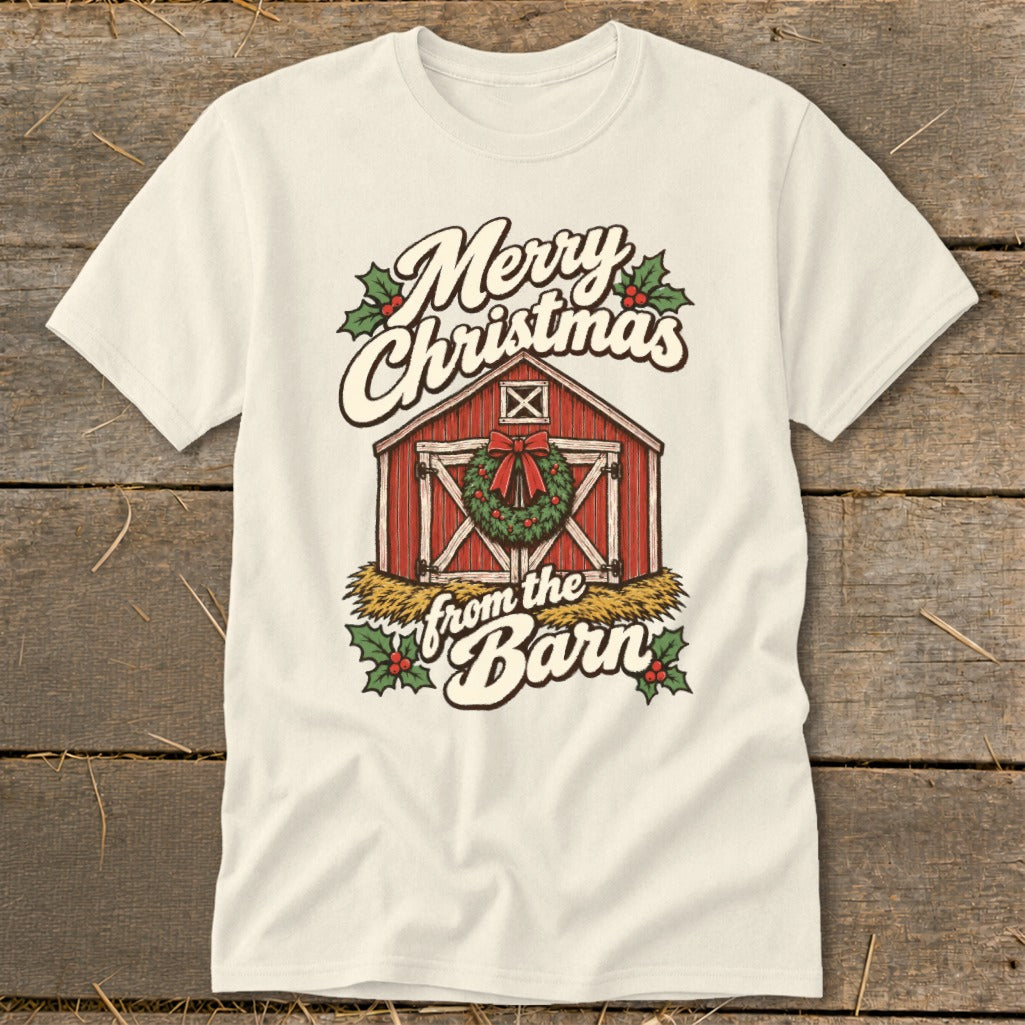 Merry Christmas from the Barn with red barn, wreath, and holly on a cream t-shirt.