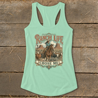 Mint green tank top with "Ranch Life Chose Me" graphic featuring a cowgirl riding a horse and cattle.