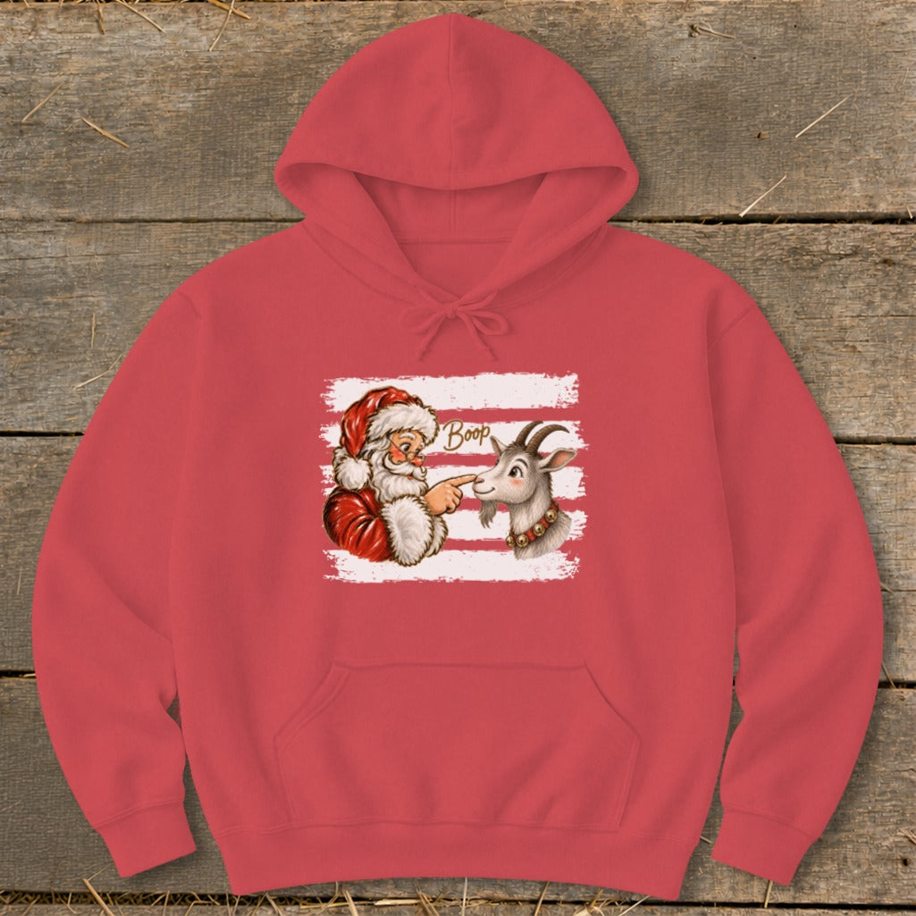 Santa booping a goat on the nose with "Boop" text on a coral hoodie.