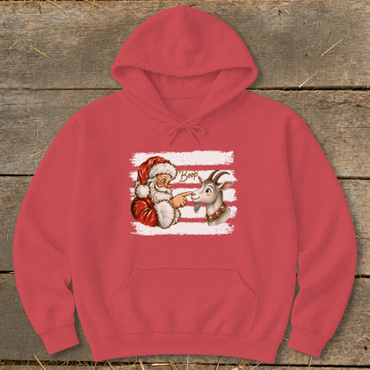 Santa booping a goat on the nose with "Boop" text on a coral hoodie.