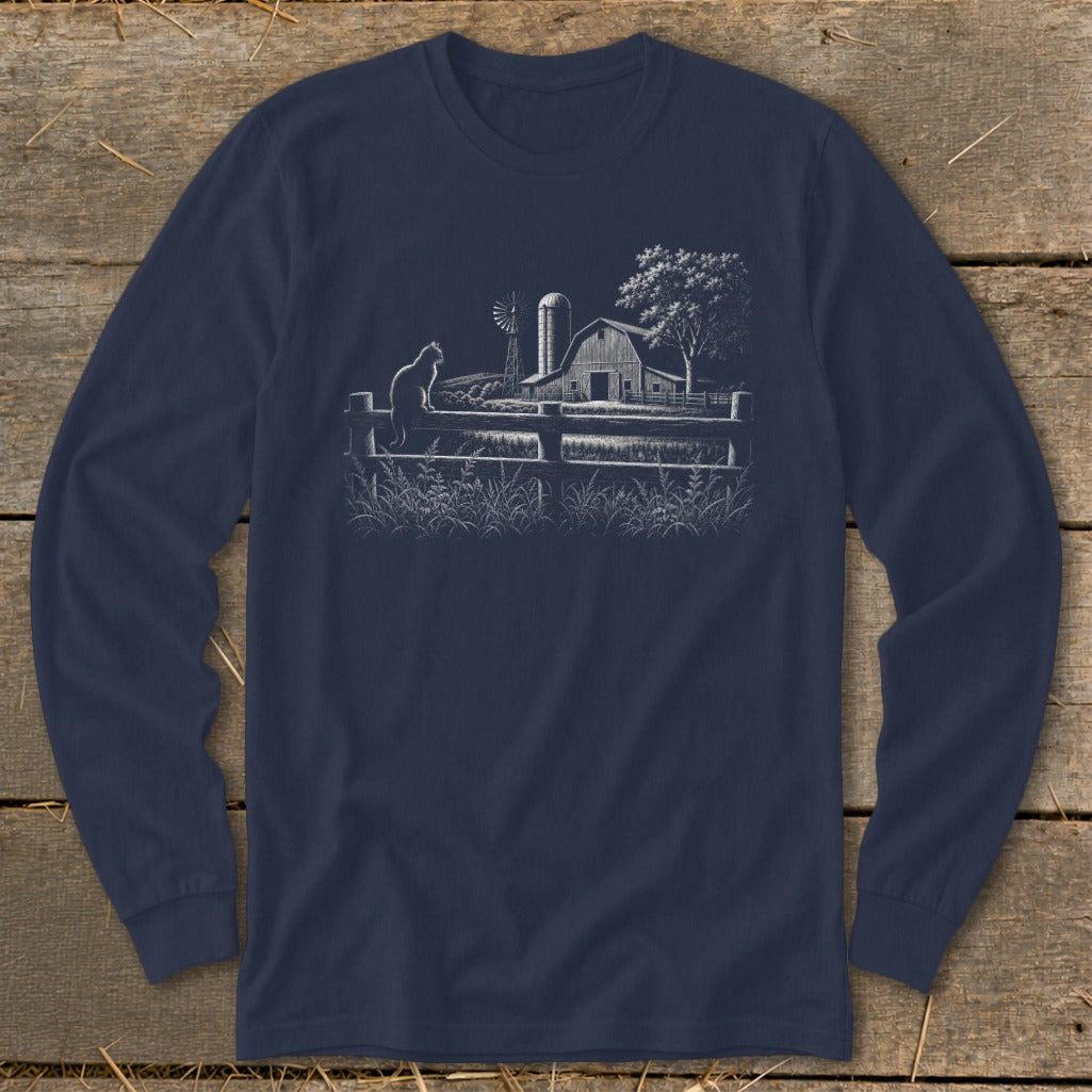 White line drawing on navy shirt shows cat on fence, barn, windmill, and tree.
