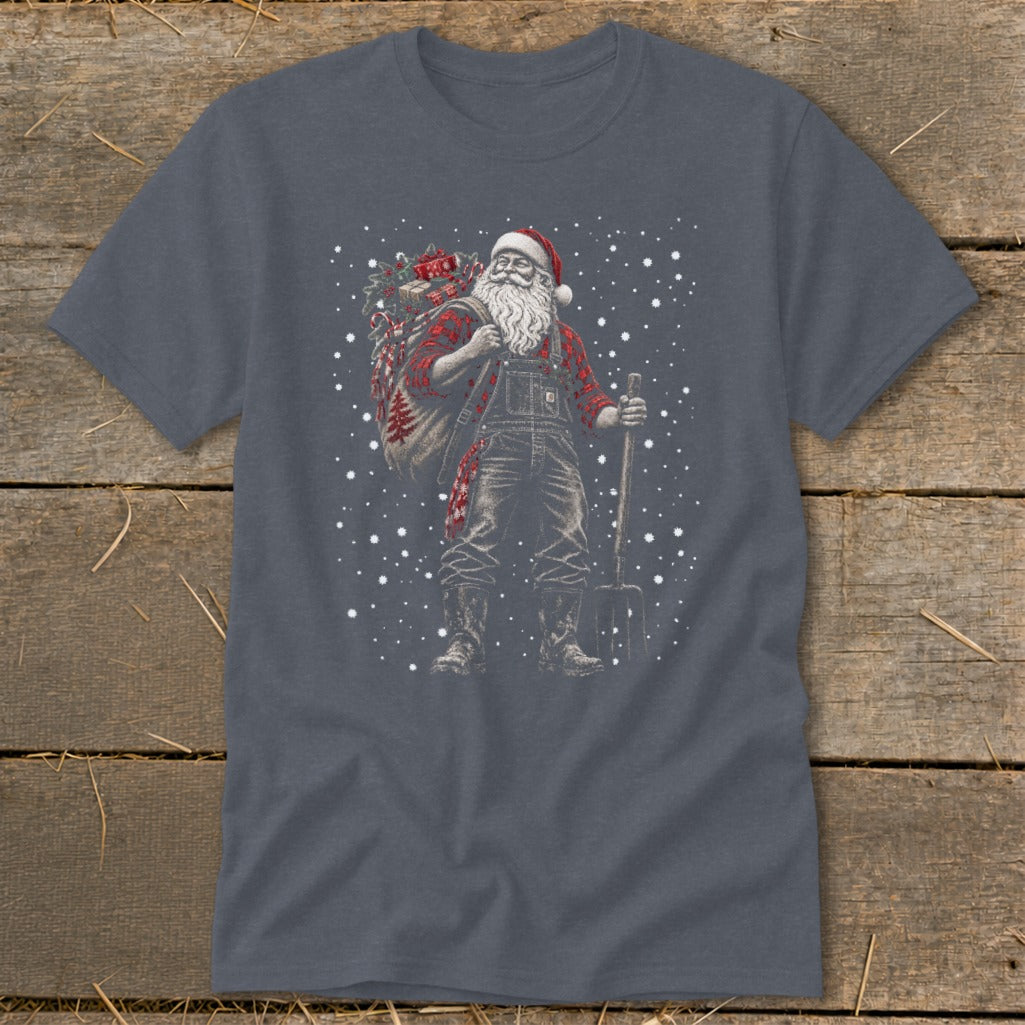 Santa Claus in overalls and plaid shirt with gift sack and pitchfork in snow.