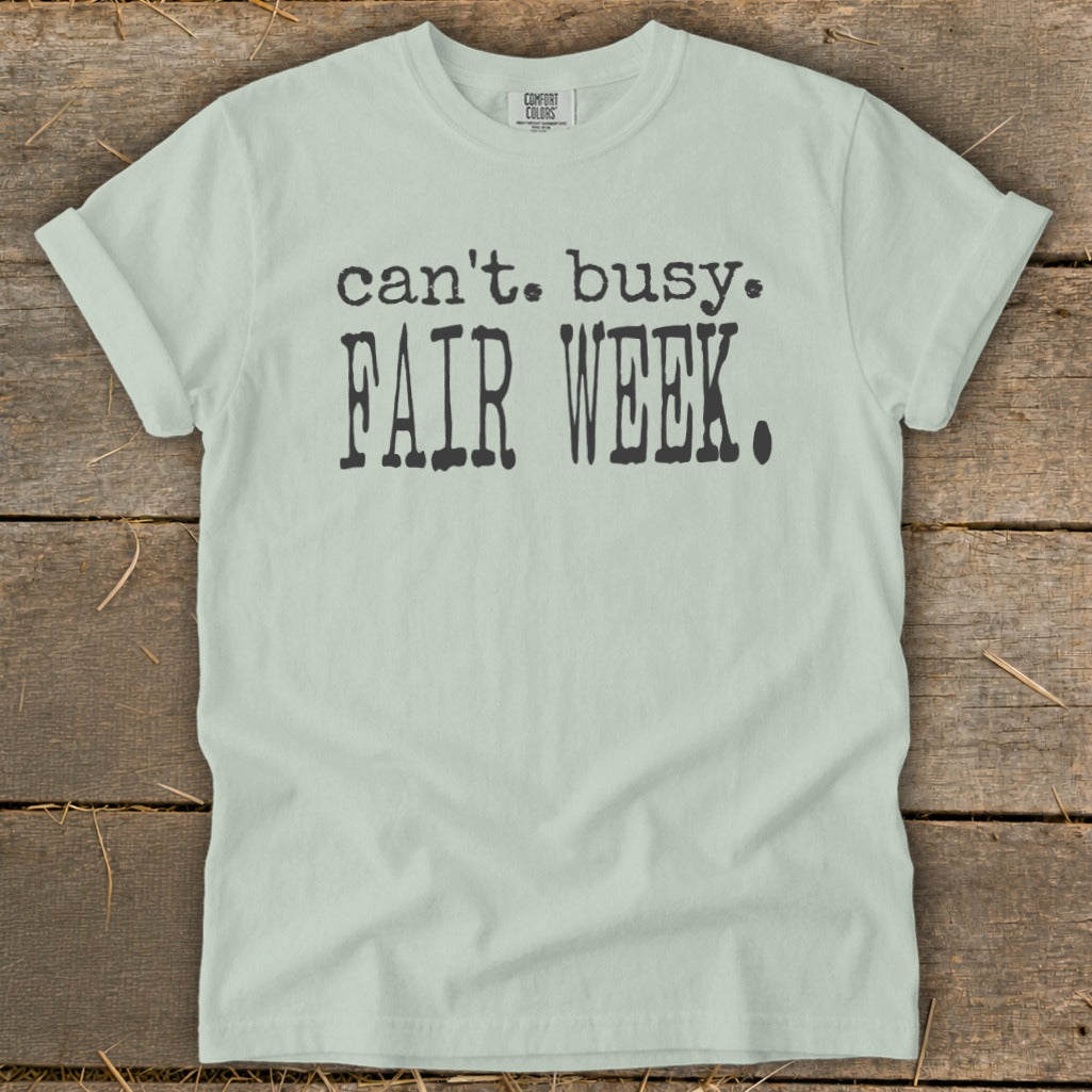 Light mint t-shirt with black text "can't. busy. FAIR WEEK."