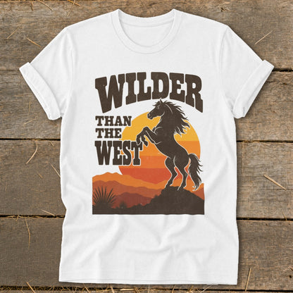 White t-shirt with "WILDER THAN THE WEST" text and a rearing horse silhouette.